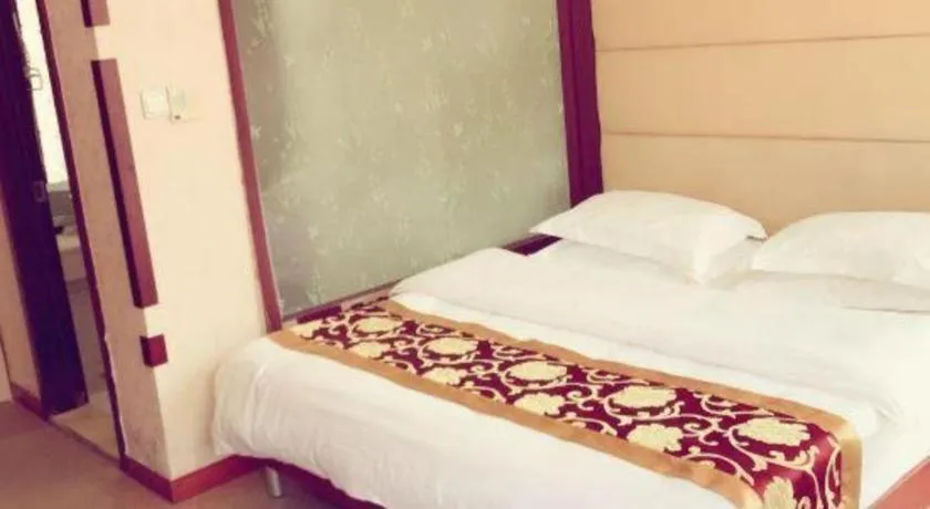 Bed in Weihai Huayu Business Hotel