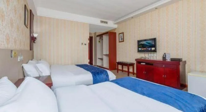 Bed in Weihai Huayu Business Hotel