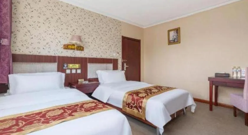 Bed in Weihai Huayu Business Hotel