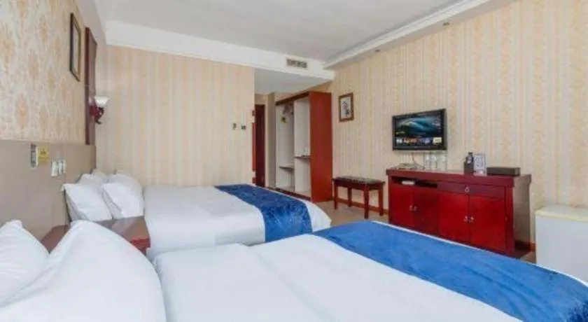 Bed in Weihai Huayu Business Hotel