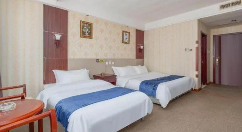 Bed in Weihai Huayu Business Hotel