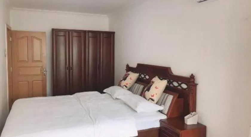 Bed in Weihai Huayu Business Hotel
