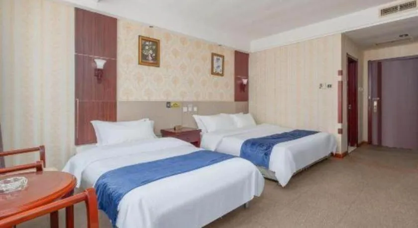 Bed in Weihai Huayu Business Hotel