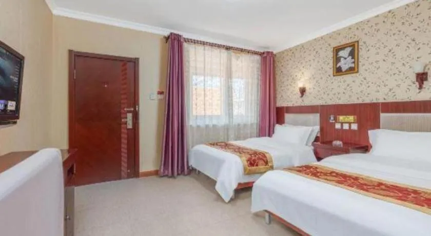 Bed in Weihai Huayu Business Hotel