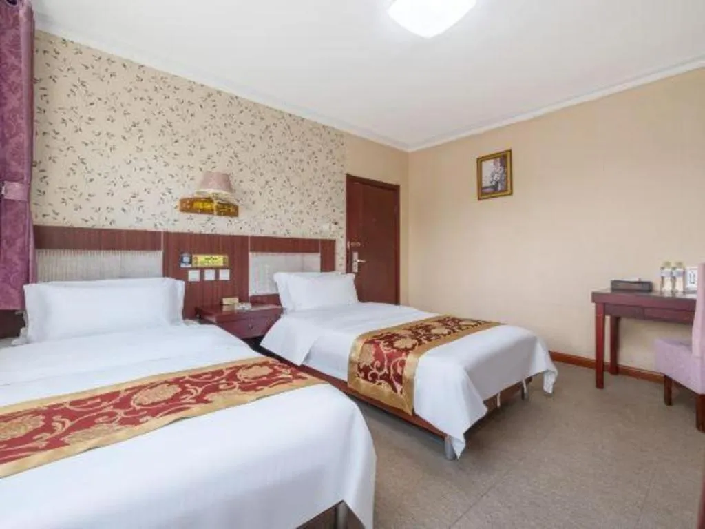 Bed in Weihai Huayu Business Hotel