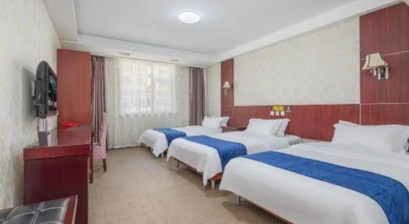Bed in Weihai Huayu Business Hotel