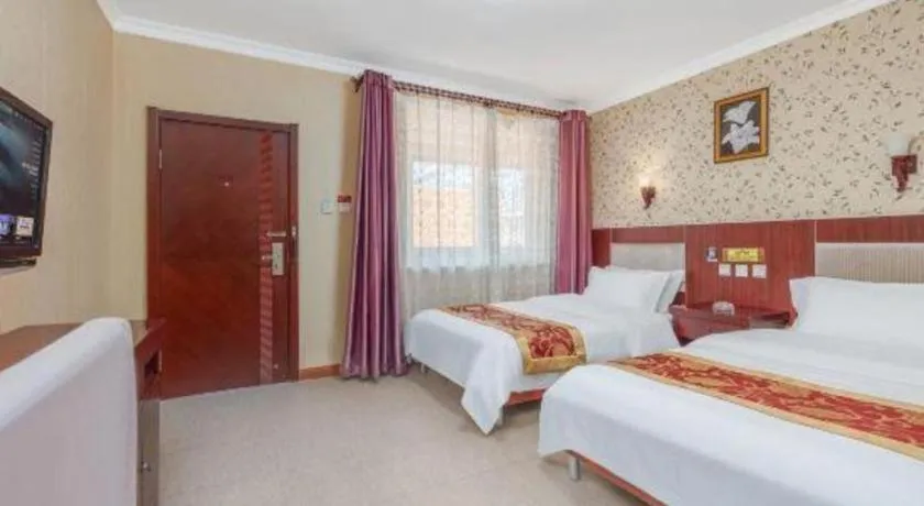 Bed in Weihai Huayu Business Hotel