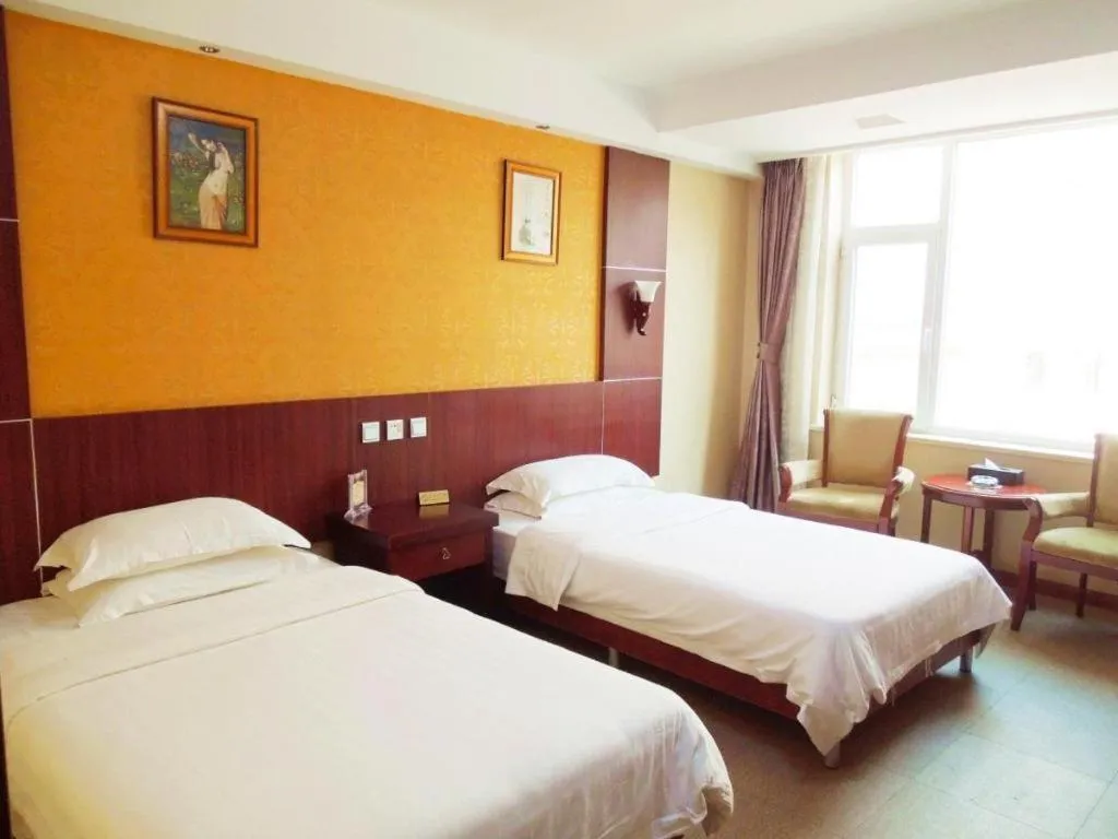 Bed in Weihai Huayu Business Hotel