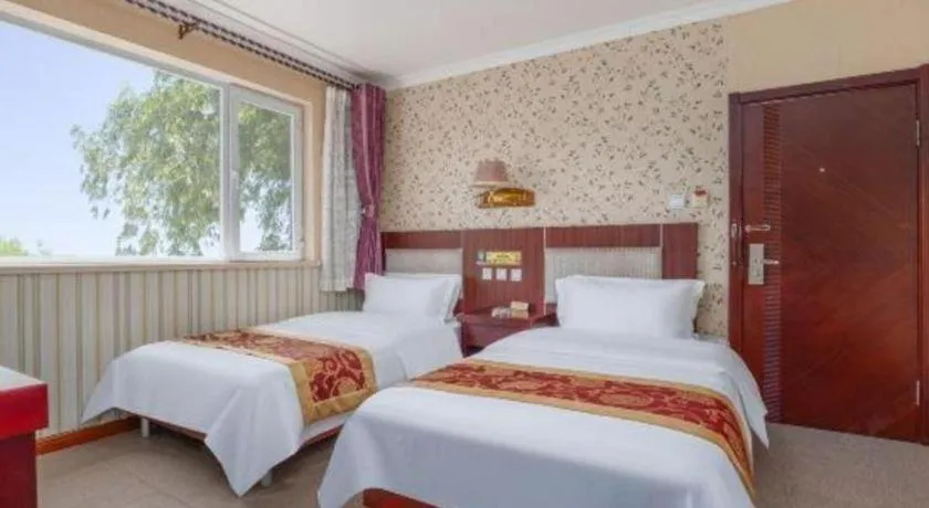 Bed in Weihai Huayu Business Hotel