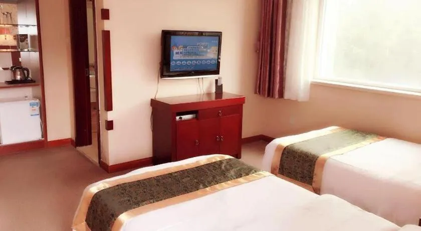 Bed in Weihai Huayu Business Hotel