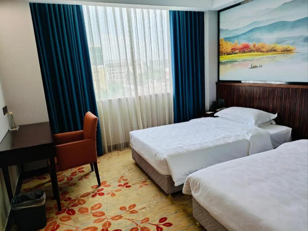 Bed in Centenio International Hotel