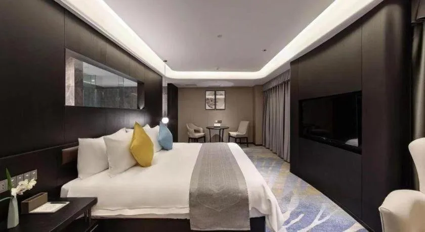 Bed in Kunming Zhong Huang Hotel