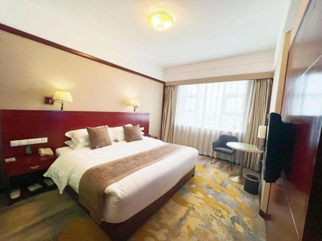 Bed in Kunming Zhong Huang Hotel