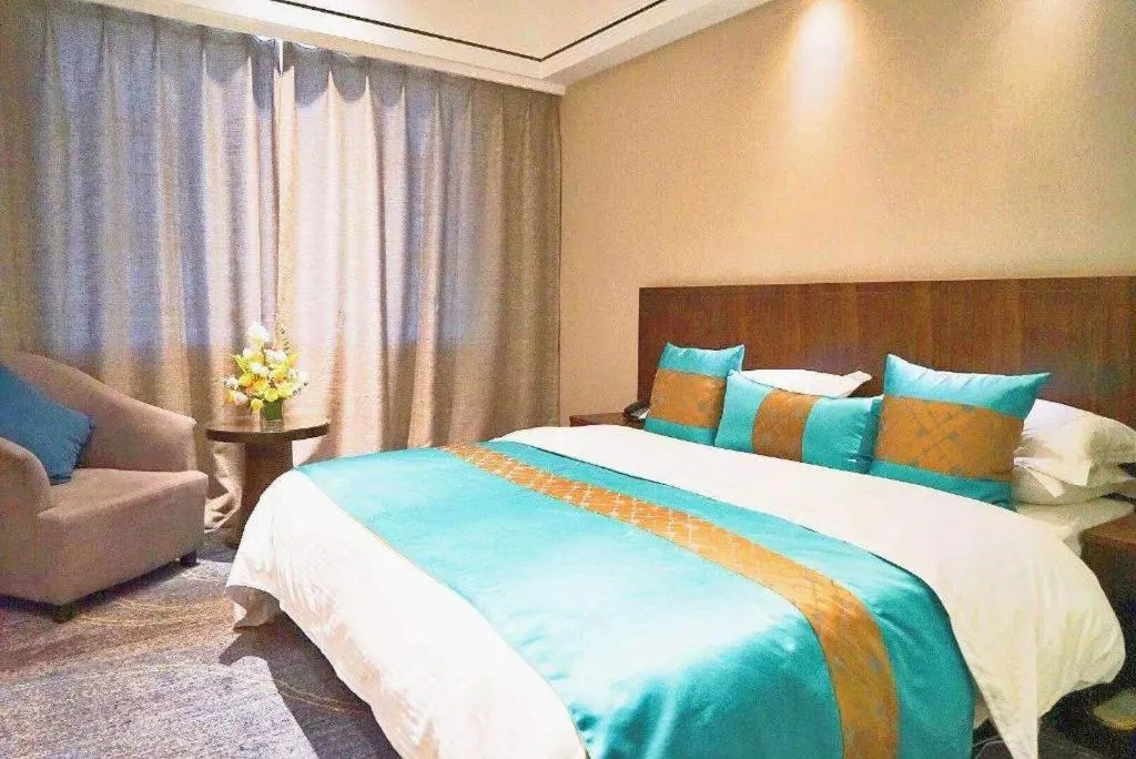 Bed in Kunming Zhong Huang Hotel