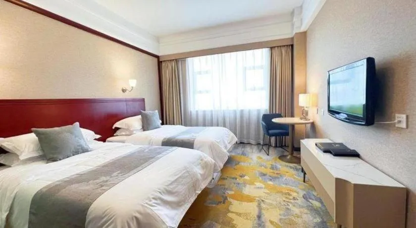 Bed in Kunming Zhong Huang Hotel