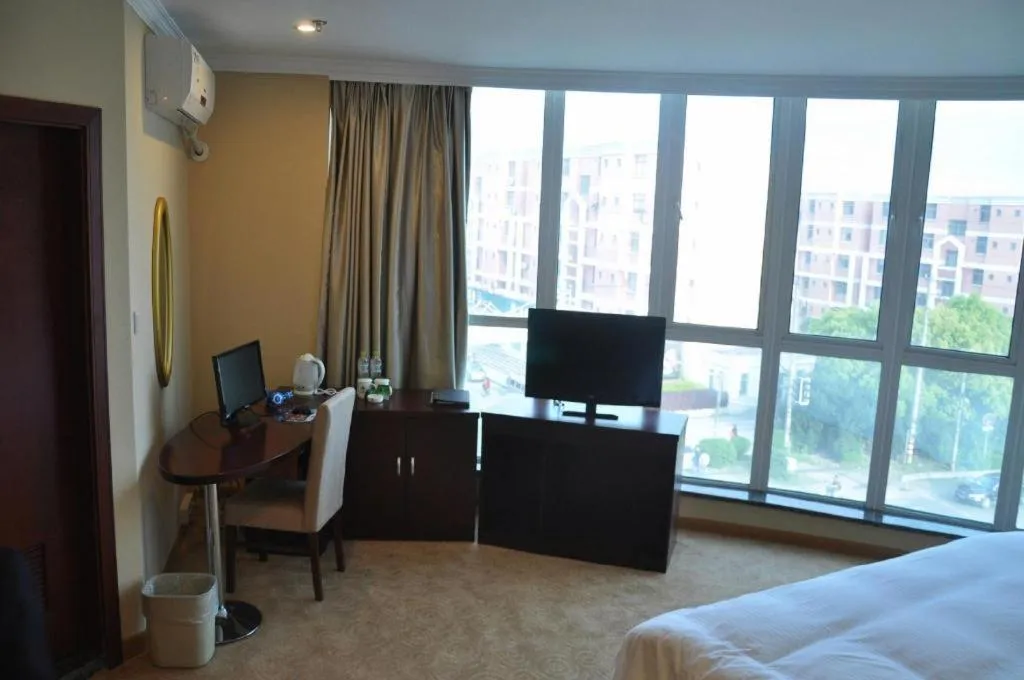 Bed in GreenTree Inn Shanghai Songjiang Xinqiao Jiuxin Road Express Hotel