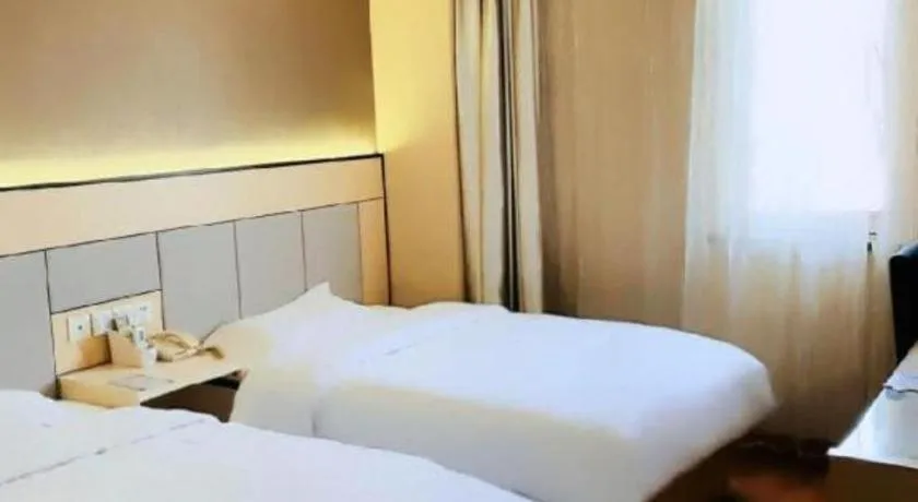 Bed in GreenTree Inn Shanghai Songjiang Xinqiao Jiuxin Road Express Hotel