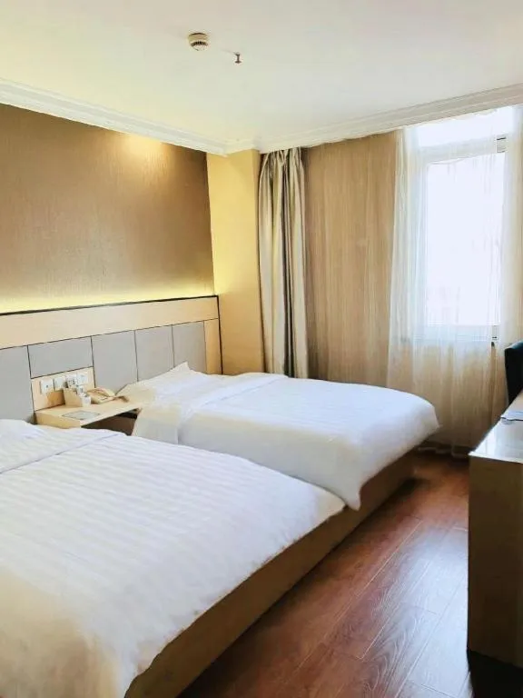 Bed in GreenTree Inn Shanghai Songjiang Xinqiao Jiuxin Road Express Hotel