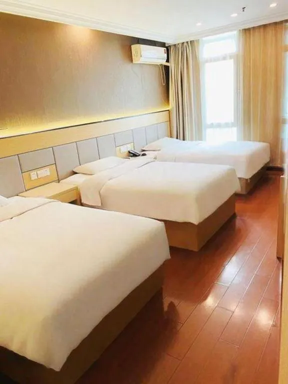 Bed in GreenTree Inn Shanghai Songjiang Xinqiao Jiuxin Road Express Hotel