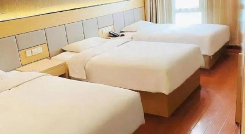 Bed in GreenTree Inn Shanghai Songjiang Xinqiao Jiuxin Road Express Hotel