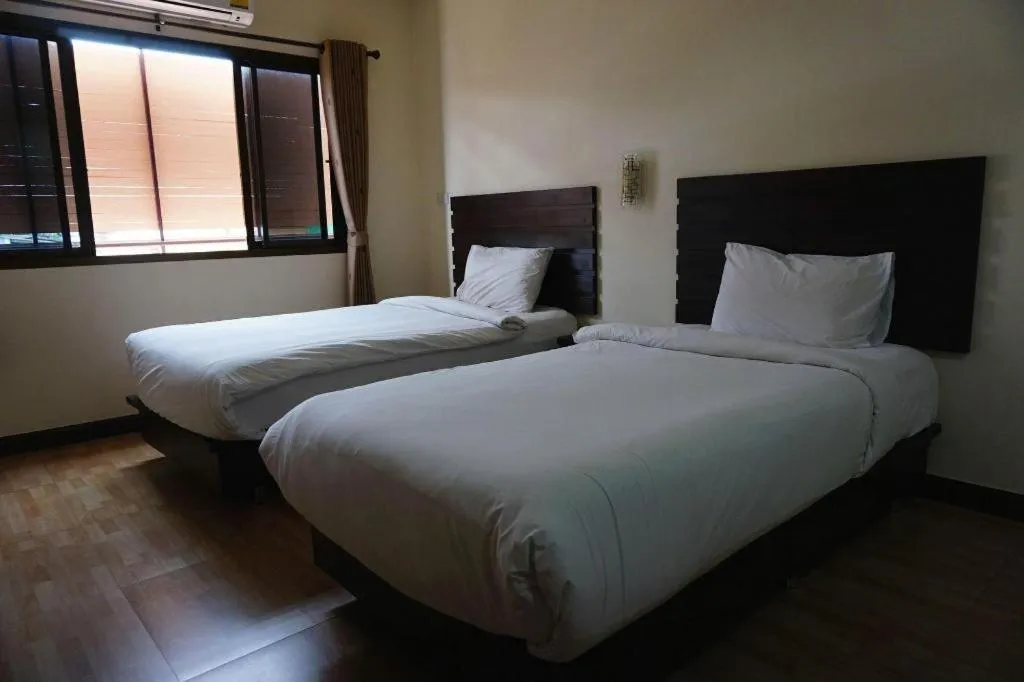 Bed in Ponburi Hotel