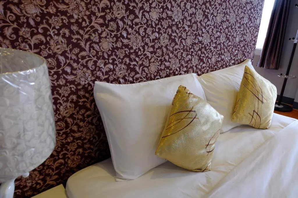 Bed in Winhouse Hotel