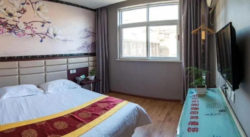 Bed in Kunlun Leju Business Hotel Kaifeng Gulou