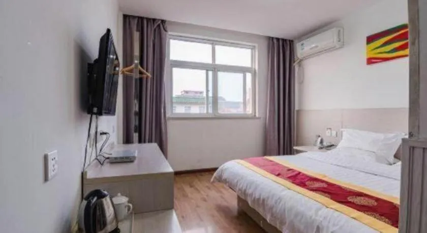 Bed in Kunlun Leju Business Hotel Kaifeng Gulou