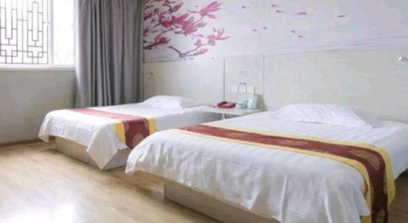 Bed in Kunlun Leju Business Hotel Kaifeng Gulou