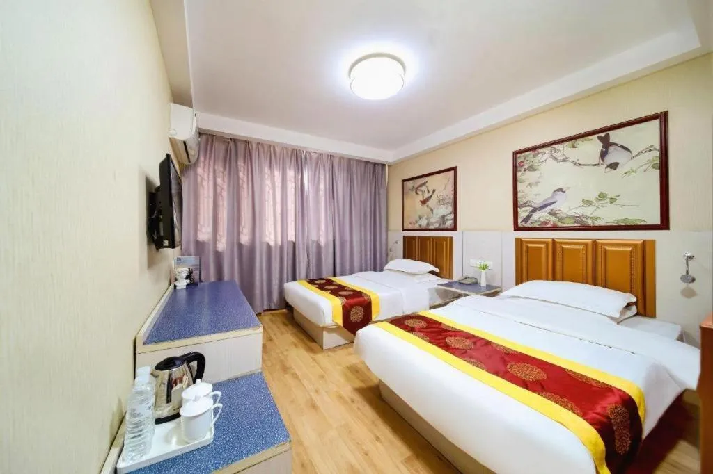 Bed in Kunlun Leju Business Hotel Kaifeng Gulou