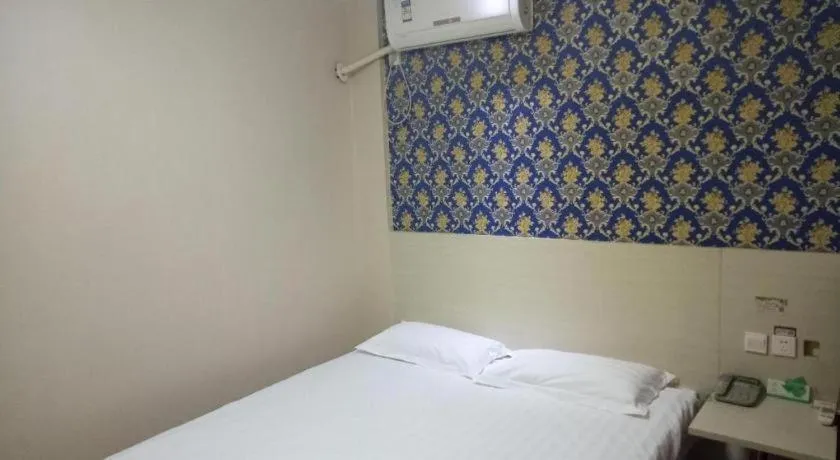 Bed in Kunlun Leju Business Hotel Kaifeng Gulou