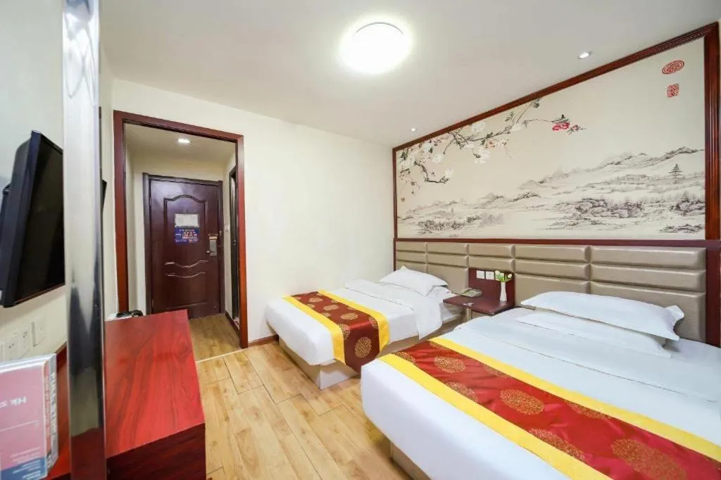 Bed in Kunlun Leju Business Hotel Kaifeng Gulou