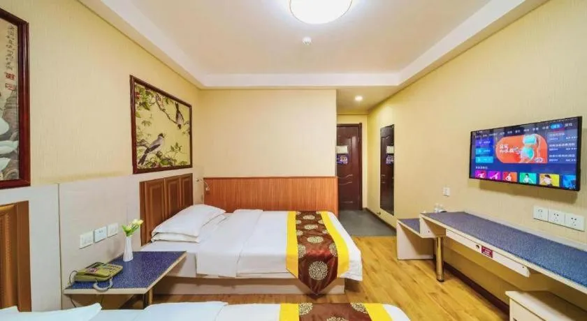 Bed in Kunlun Leju Business Hotel Kaifeng Gulou