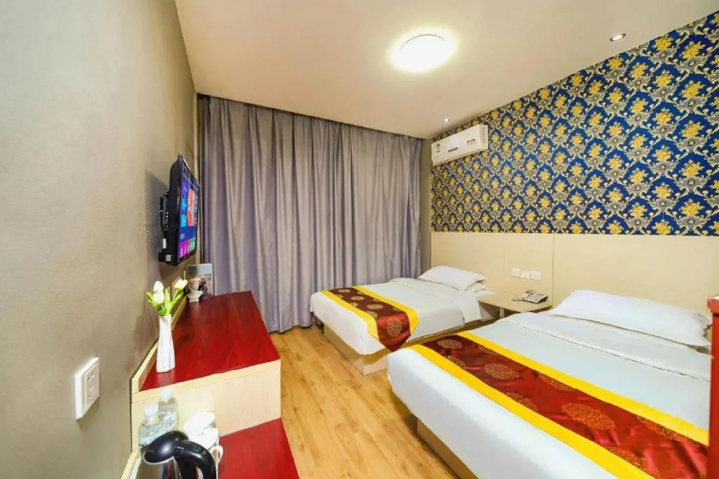 Bed in Kunlun Leju Business Hotel Kaifeng Gulou