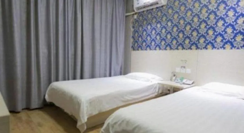 Bed in Kunlun Leju Business Hotel Kaifeng Gulou