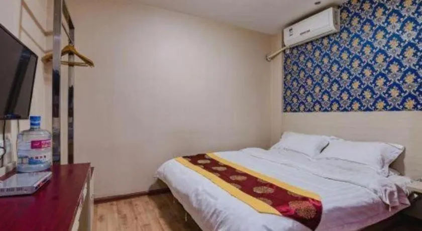 Bed in Kunlun Leju Business Hotel Kaifeng Gulou