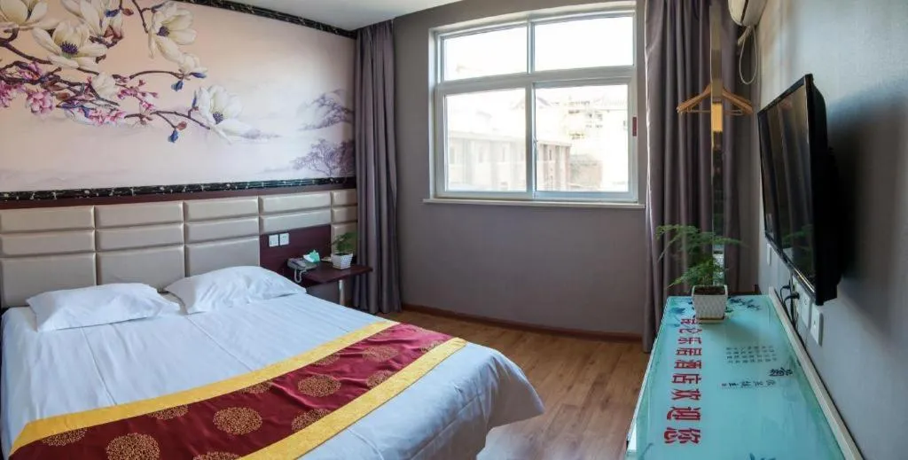 Bed in Kunlun Leju Business Hotel Kaifeng Gulou