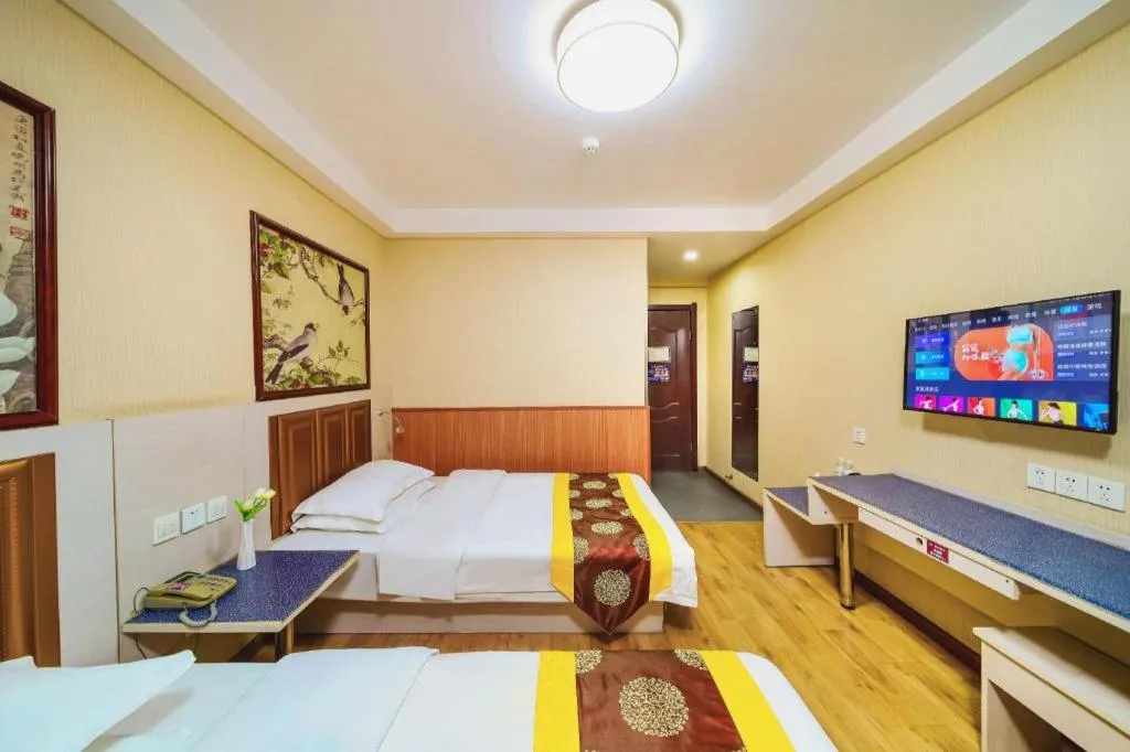 Bed in Kunlun Leju Business Hotel Kaifeng Gulou