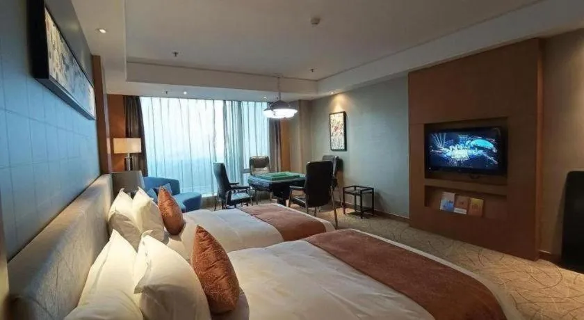 Bed in Wuhan Soluxe Hotel