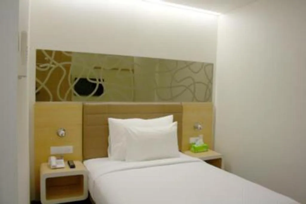 Bed in Sub City Hotel