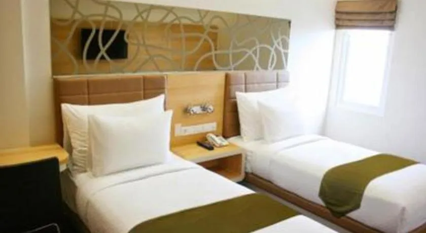 Bed in Sub City Hotel