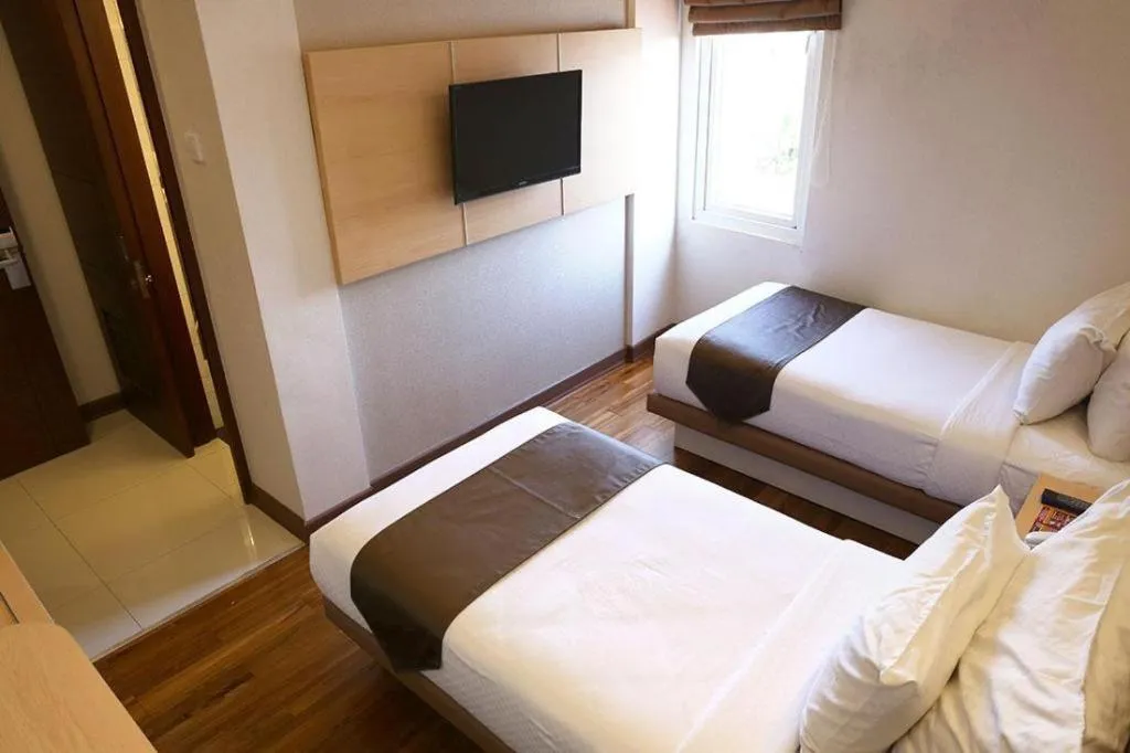 Bed in Sub City Hotel