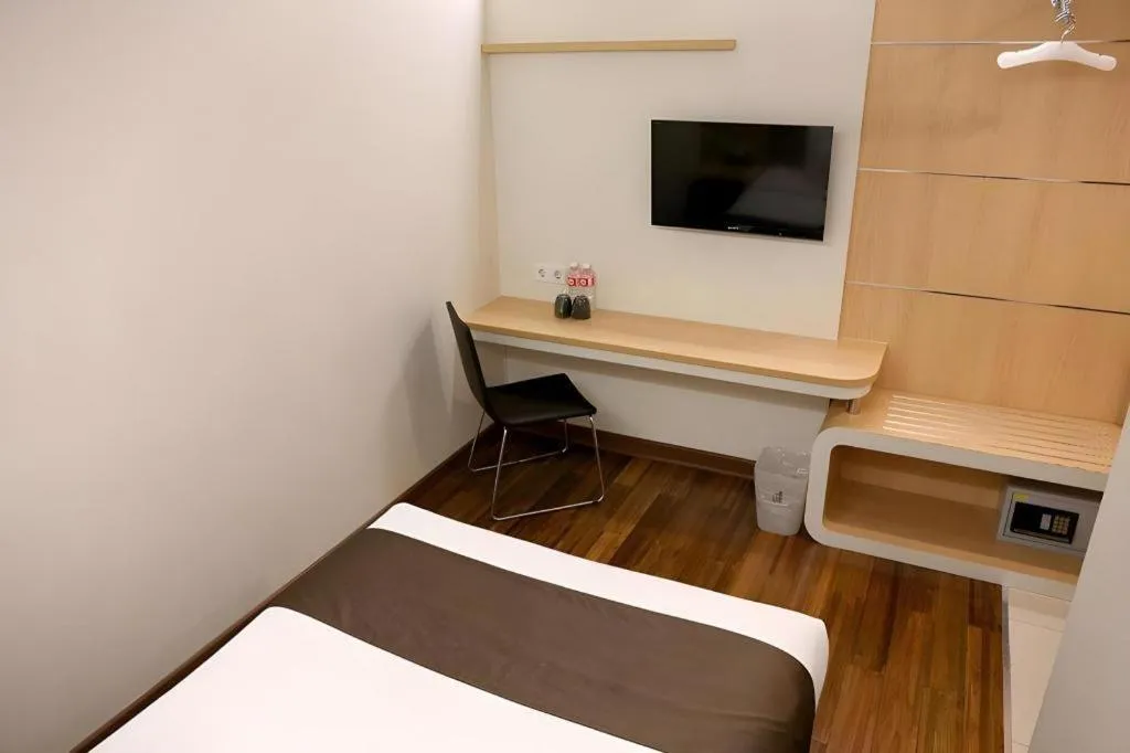 Bed in Sub City Hotel