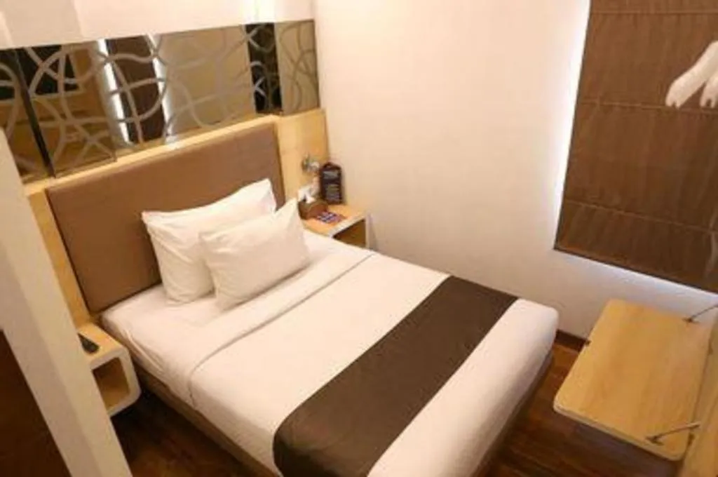 Bed in Sub City Hotel