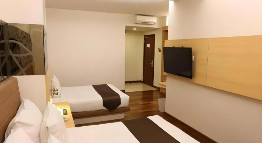 Bed in Sub City Hotel