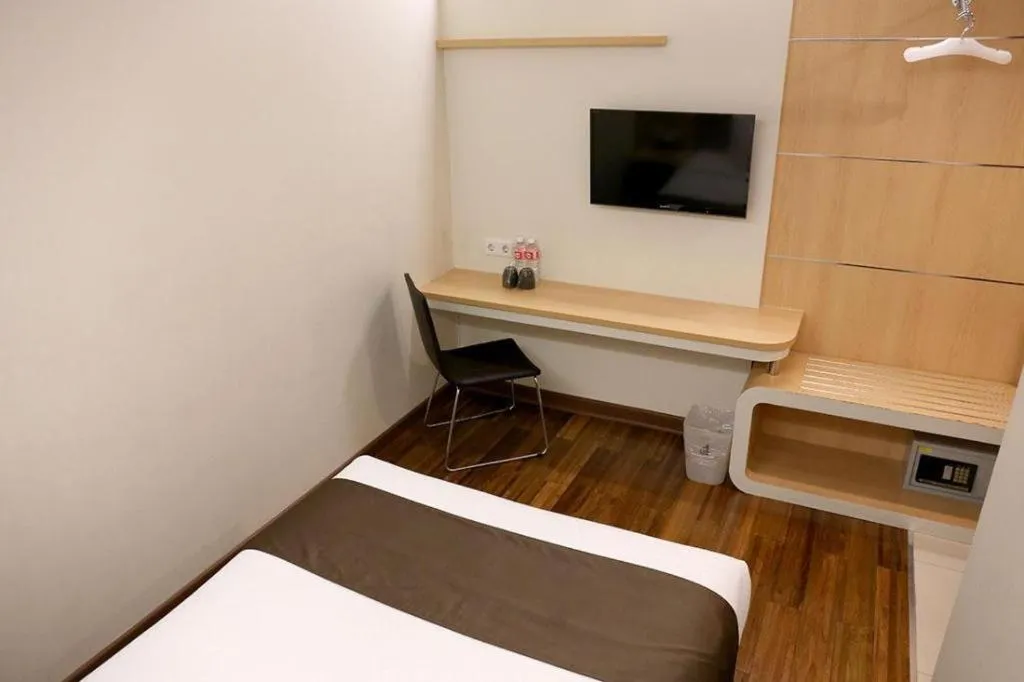 Bed in Sub City Hotel