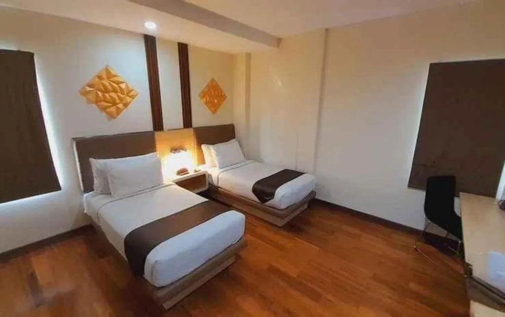 Bed in Sub City Hotel