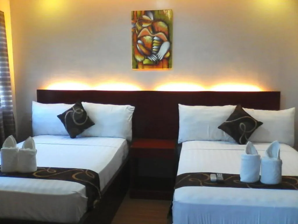 Bed in Rovic's Tourist Hotel