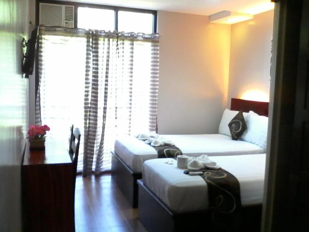 Bed in Rovic's Tourist Hotel