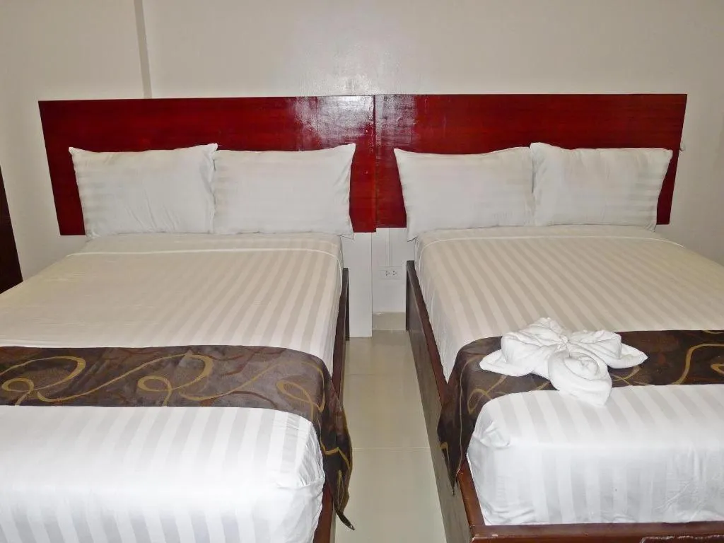 Bed in Rovic's Tourist Hotel